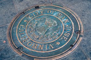 San Jose / California / USA: Close up of a City of San Jose Manhole Cover on the sidewalk in the downtown area