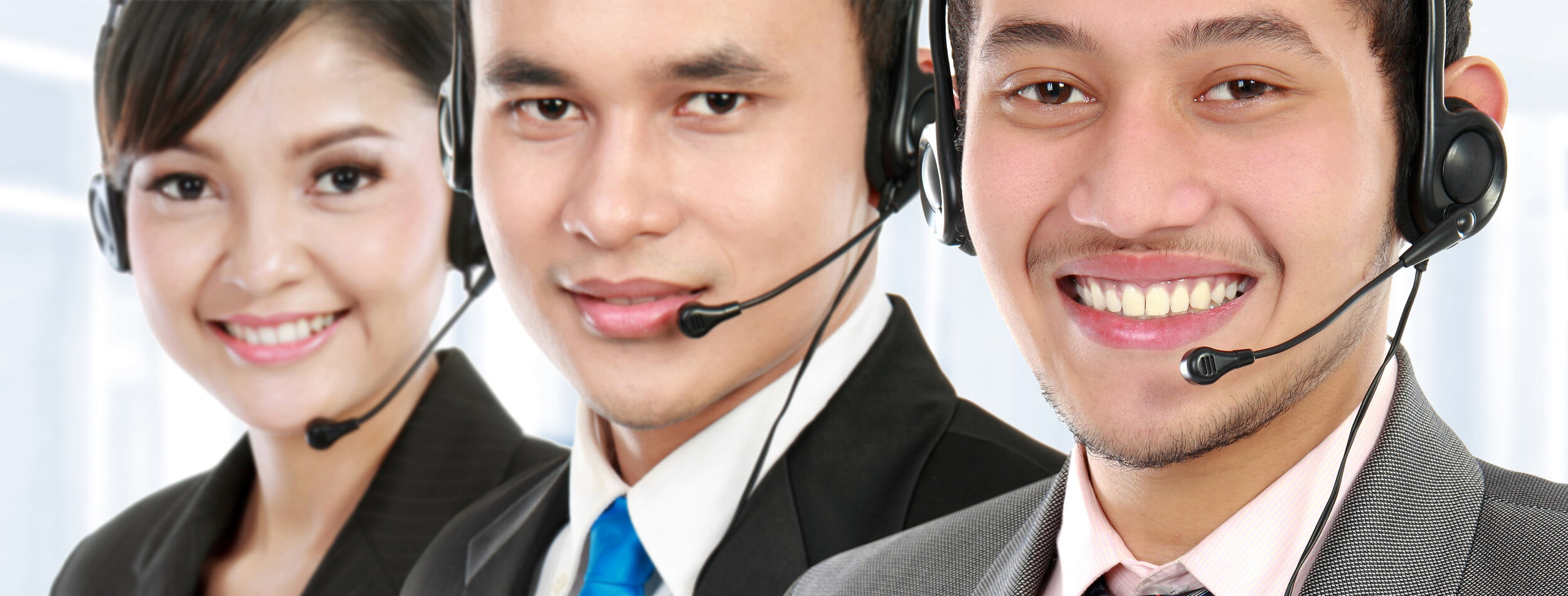 worker call center smiling with colleague in background