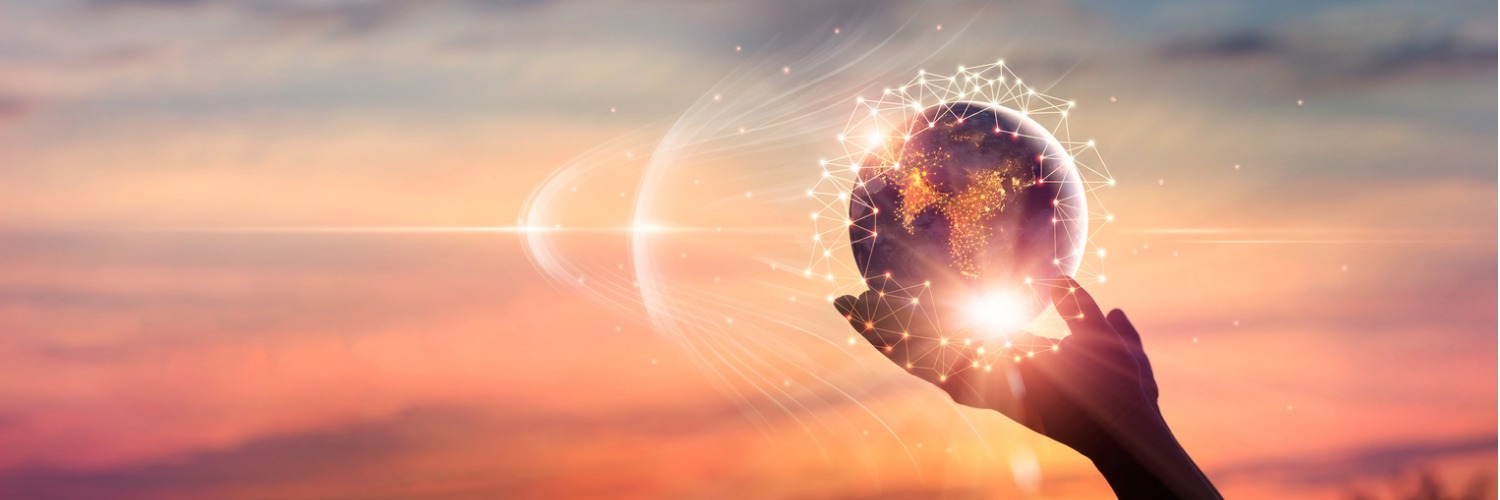 Hand holding a globe